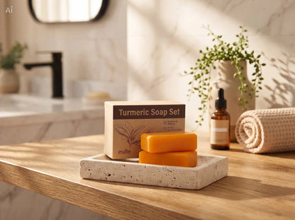Unica Kojic Acid and Turmeric Soap Duo in warm lighting, showcasing two bars of soap with natural turmeric and kojic acid ingredients.