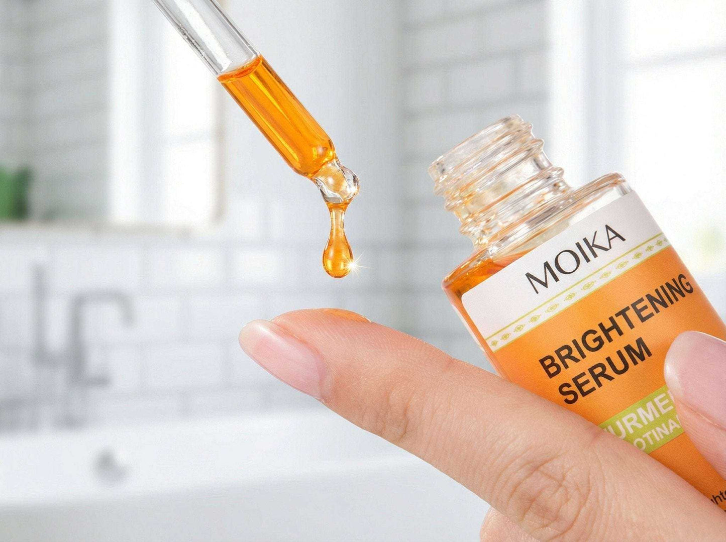 Turmeric & Niacinamide brightening serum drop on fingertip for skincare routine