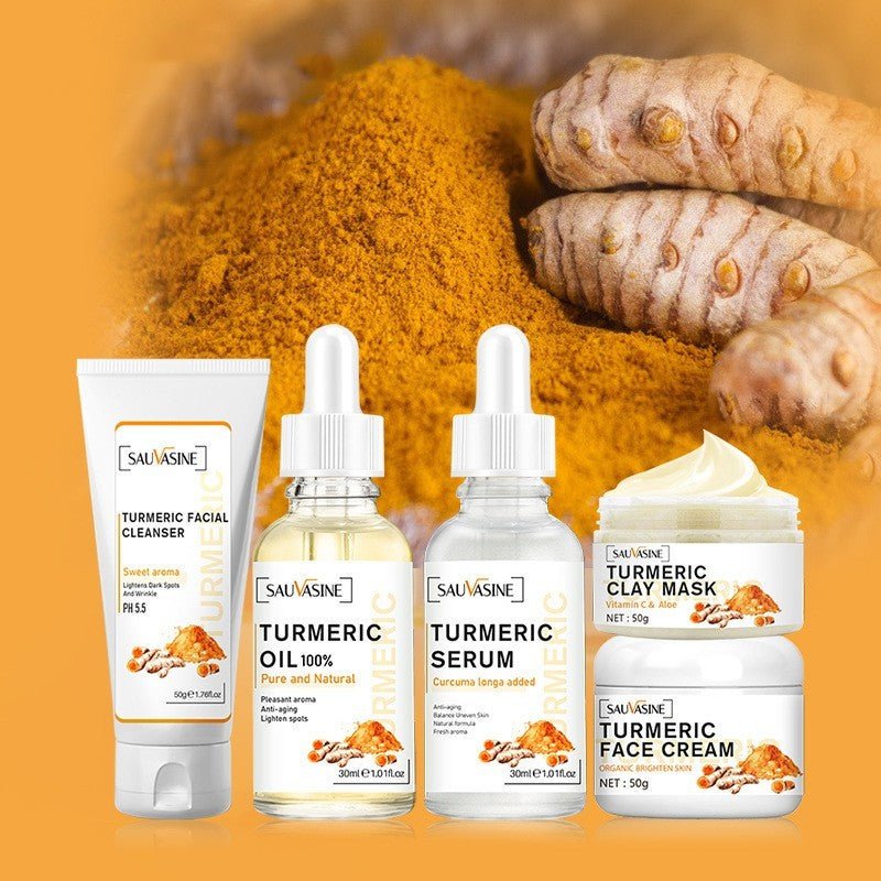 Radiant Revival Turmeric skincare kit with cleanser, turmeric oil, serum, clay mask, and face cream on turmeric powder background