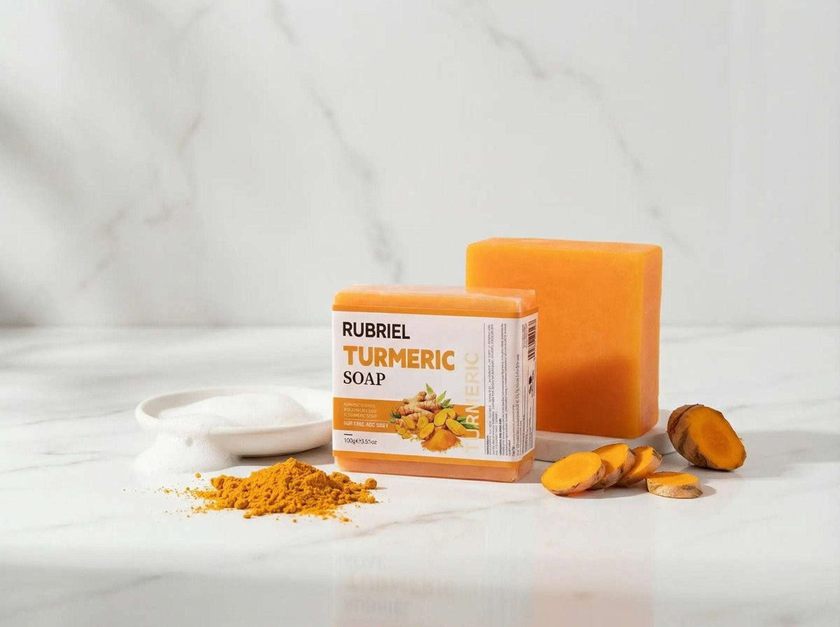 Golden Glow Turmeric Facial Soap bar with turmeric powder and slices on white marble background